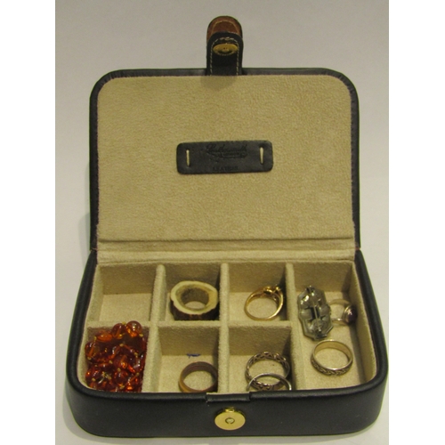 4449 - A jewellery box with various rings including silver, an amber necklace and marcasite brooch