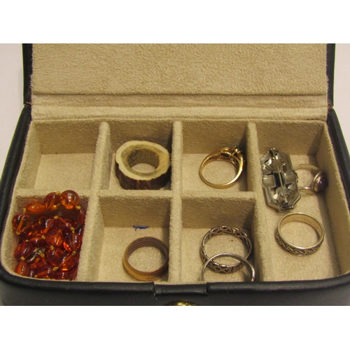 4449 - A jewellery box with various rings including silver, an amber necklace and marcasite brooch