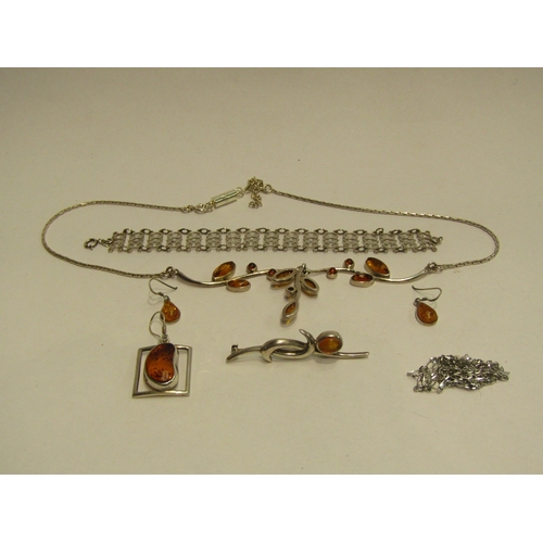 4451 - A bag of white metal and 925 bijouterie including amber necklace, brooch etc.