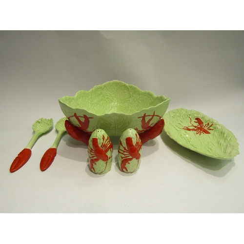 4462 - A Carlton Ware salad dish having lobster supports together with salad servers, dish and salt and pep... 