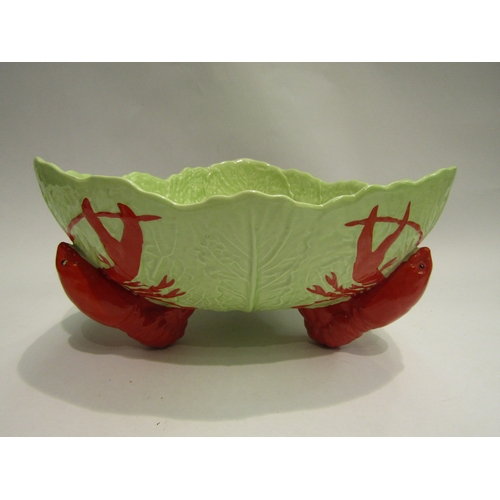 4462 - A Carlton Ware salad dish having lobster supports together with salad servers, dish and salt and pep... 