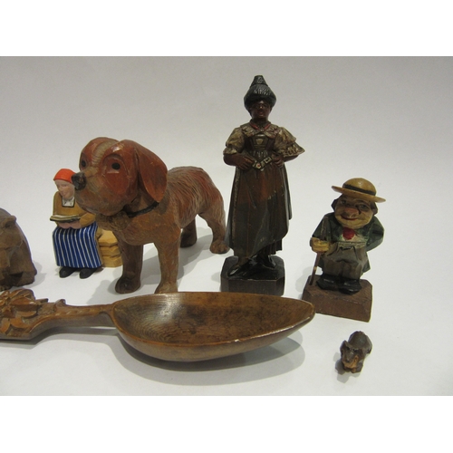 4394 - A selection of Black Forest/chip carved figures and spoon, some painted, including dog, bear, old ge... 