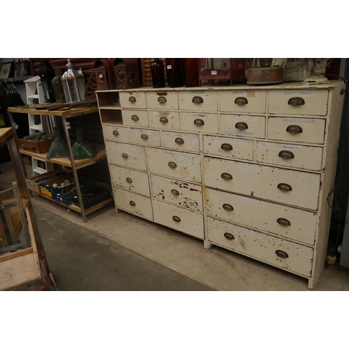 2097 - A Victorian painted pine bank of 24 (of 26) drawers 200w x 32d x 126cm tall