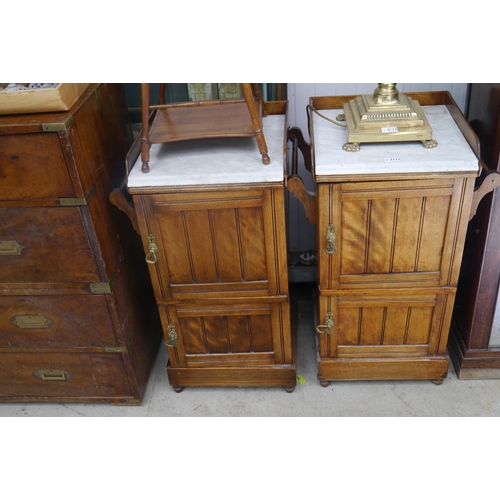 2111 - A pair of Edwardian walnut marble topped night stands, two doors and drawers to interior