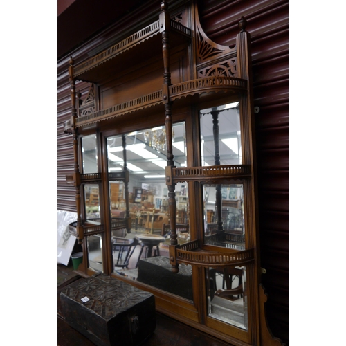 2122 - An Edwardian walnut overmantel mirror