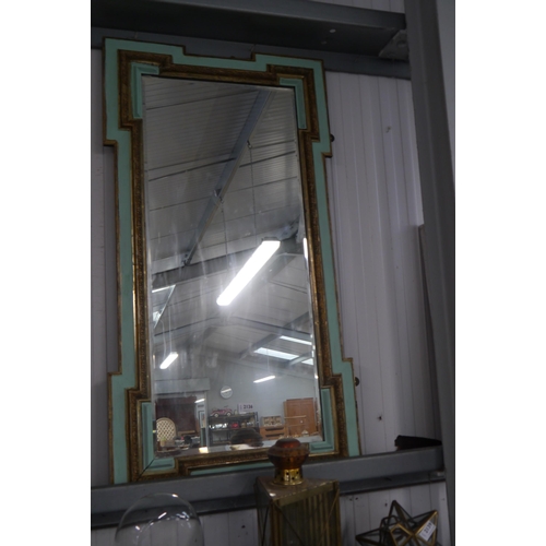 2136 - A large bevelled pier mirror in irregular rectangular frame