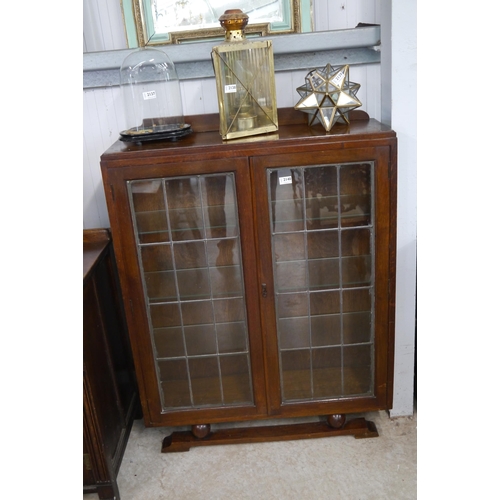 2140 - An Art Deco oak and glazed two door bookcase