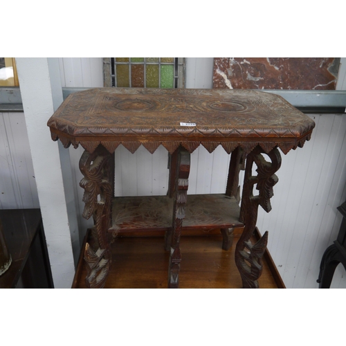 2158 - An Eastern hardwood carved occasional table