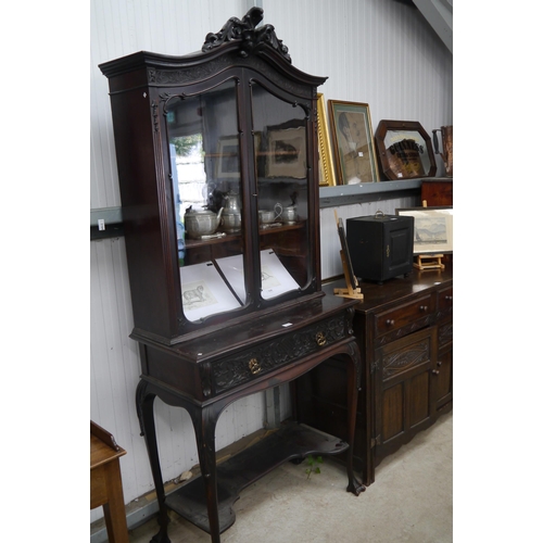 2161 - A Victorian carved and ebonised mahogany cabinet on stand with central drawer