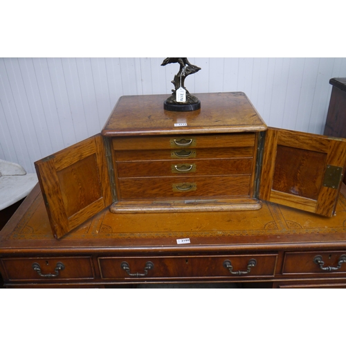 2179 - A 19th Century burr oak cutlery cabinet