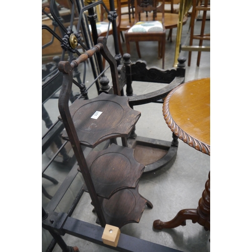 2271 - A carved oak corner stick stand and a three tier cake stand