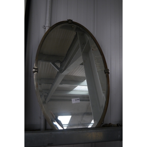 2298 - A bevelled Art Deco oval mirror and framed hall rules wall hanging