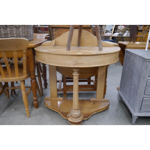 2313 - A Victorian pine demi-lune washstand