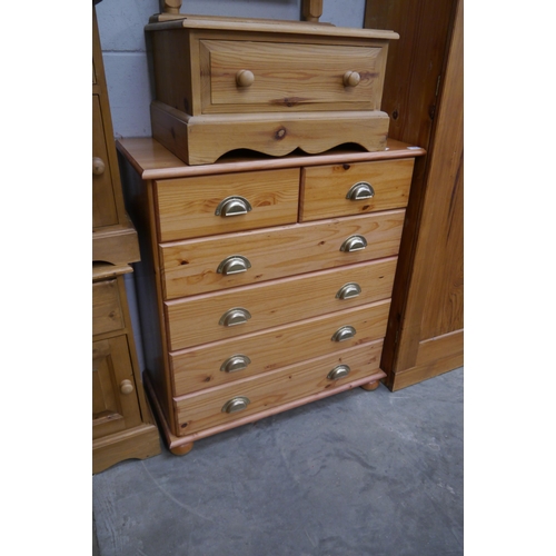 2352 - A modern pine chest of two short over four long drawers, brass cup handles