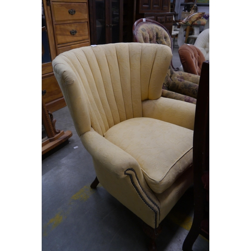 2407 - A Art Deco shel back armchair with studded details on carved cabriole pad feet