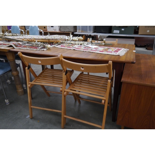 2415 - A 1970's Danish teak extending dinng table