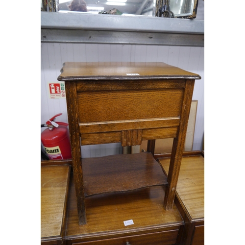 2426 - A nest of three fitting tables, sewing box, table and chair