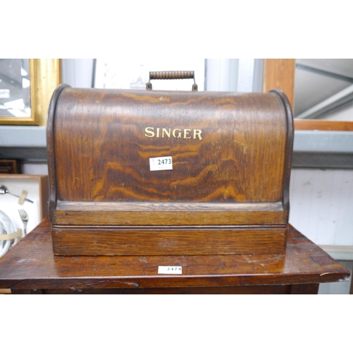 2473 - A dome cased Singer sewing machine