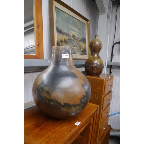 2477 - Two oversized pottery vases, one bulbous, the other double gourd