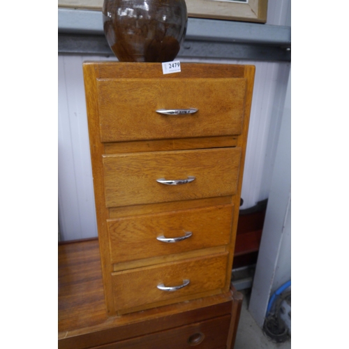 2479 - An oak four drawer bedside chest