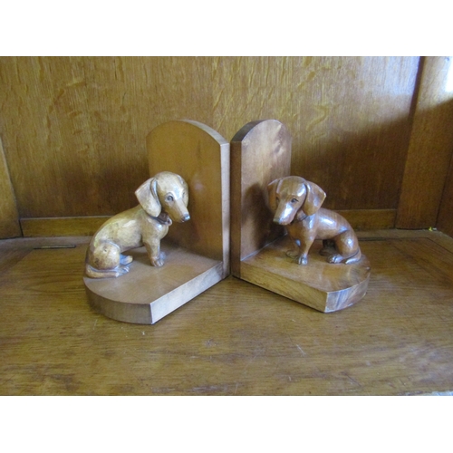 4007 - A pair of Dachshund chip carved bookends, 15.5cm tall