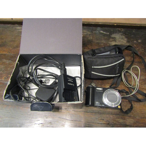 4255 - A hardshell camera case with instant camera, a portable CD player and wind up radio etc.