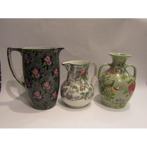 4278 - A Copeland late Spode green transfer printed two - handled vase, painted in colours with flowers and... 