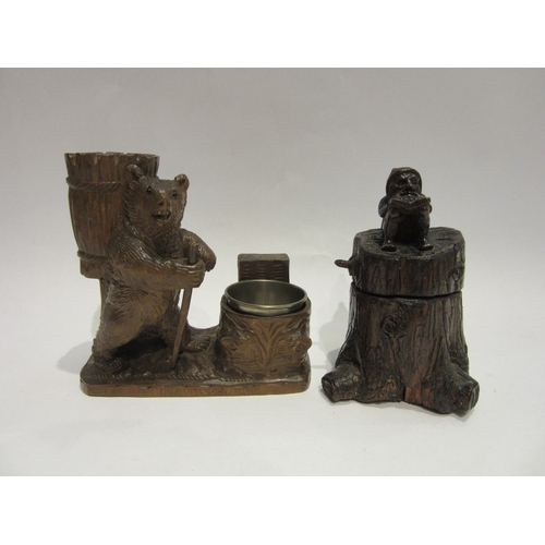 4510 - Two Black Forest inkwells, tree trunk form with seated reading gnome and hiking bear, 12cm and 13cm ... 