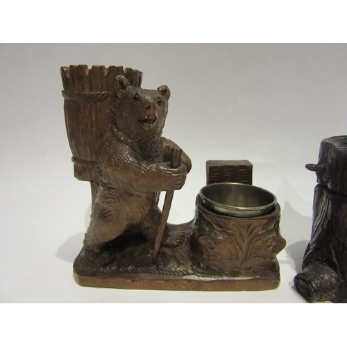 4510 - Two Black Forest inkwells, tree trunk form with seated reading gnome and hiking bear, 12cm and 13cm ... 