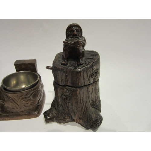 4510 - Two Black Forest inkwells, tree trunk form with seated reading gnome and hiking bear, 12cm and 13cm ... 