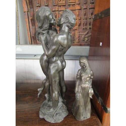 2150 - Two resin bronze figures, a loving couple and a girl