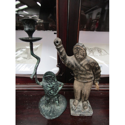 2164 - A soap stone Inuit hunter and a verdegis brass/ bronze frog candle stick