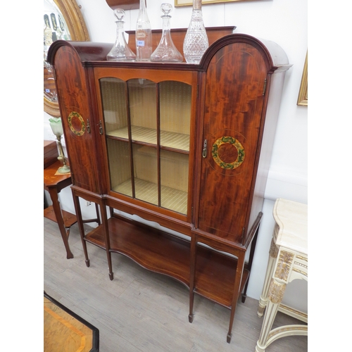 6109 - An Edwardian mahogany display cabinet, the central fabric lined cupboard enclosed by a single astrag... 