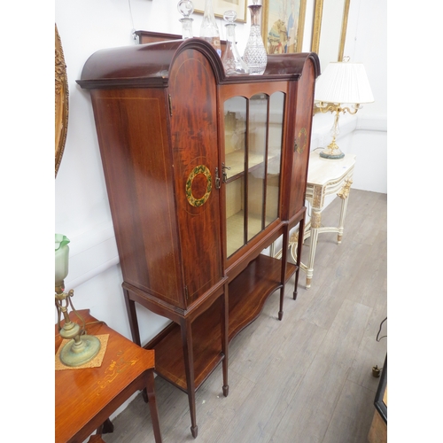 6109 - An Edwardian mahogany display cabinet, the central fabric lined cupboard enclosed by a single astrag... 