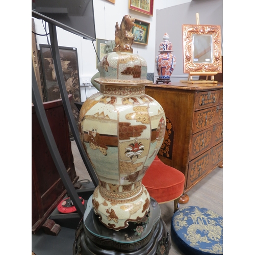 6006 - A modern large satsuma hexagonal lidded jar on ceramic base.  The vase is decorated with soldiers, f... 