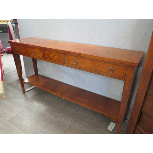 6055 - A 20th/21st Century George III style walnut slim side table with two drawers and an under-tier.  72.... 