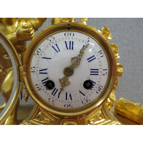 6054 - A 19th Century French ormolu mantel clock, the case surmounted by angel, bird, roses and drum.  Two ... 