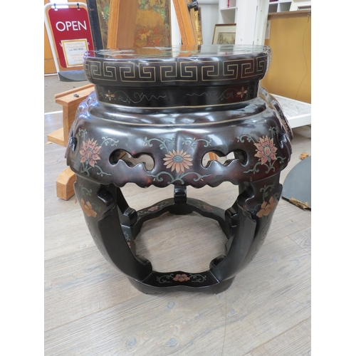 6007 - A shaped top Oriental ebonised occasional table with painted and carved decoration having fretwork d... 