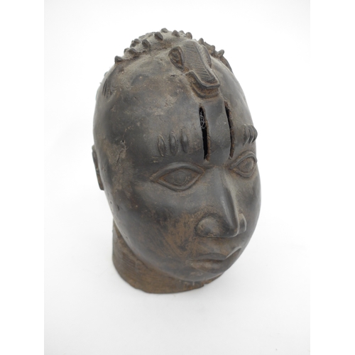 6312 - An African Benin bronze head made by Edo most likely representing the head of the King, the head sur... 