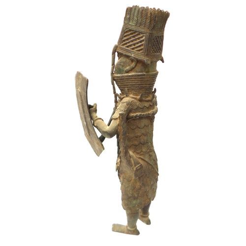 6295 - An Edo Benin bronze sculpture of a standing male warrior with spear and shield, 43cm tall