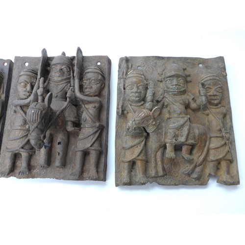 6296 - Six Edo Benin relief plaques of rectangular form. Three depicting Oba, on horseback, the backgrounds... 