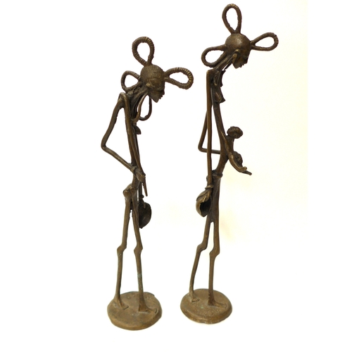 6290 - Two African bronze Makonde, Hunger figures 46.5cm tall