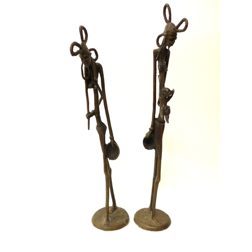 6290 - Two African bronze Makonde, Hunger figures 46.5cm tall