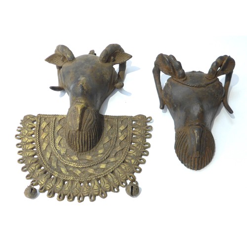 6306 - A bronze Owo rams head pendant. 'Osanmasinmi' Nigerian and a smaller example 30cm and 21cm