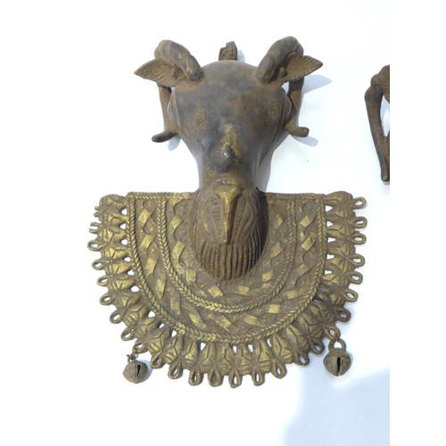 6306 - A bronze Owo rams head pendant. 'Osanmasinmi' Nigerian and a smaller example 30cm and 21cm