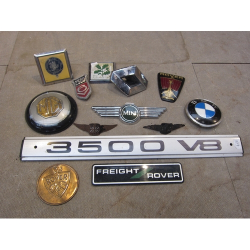 5054 - A box of mixed badges, etc including BMW, Rover, MG and Renault, etc