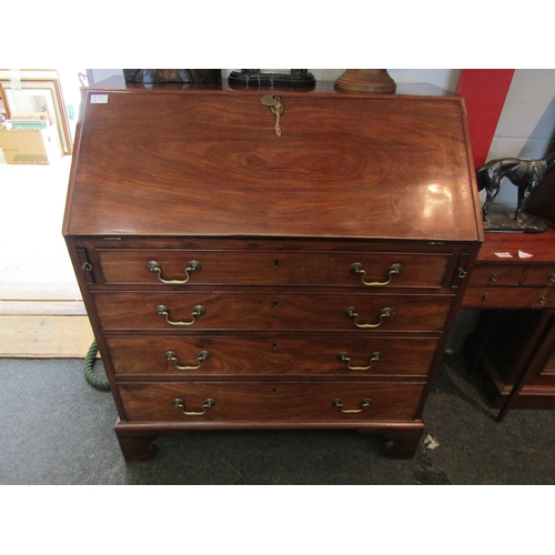 1093 - A 19th Century mahogany bureau, drop-flap with fitted interior, four graduating long drawers on brac... 