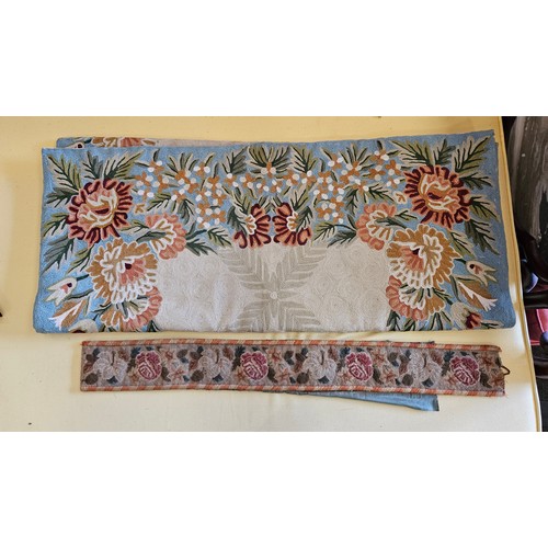 1103 - An embroided floral tapestry panel together with embroided curtain holder