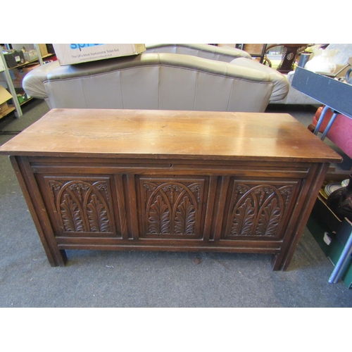 1192 - A modern oak blanket box with carved panelled front, 64cm tall x 122cm wide x 49cm deep