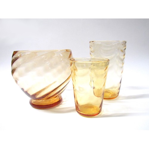 1310 - Two Whitefriars waved tumbler vases in amber, 20.5cm and 15.5cm high, together with a similar colour... 